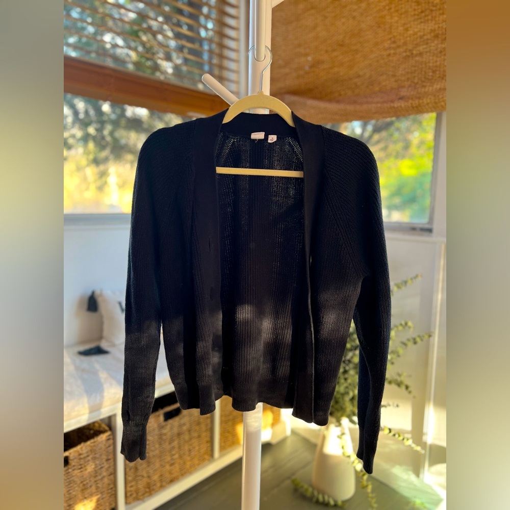 Simple black cardigan with pockets. Size medium.